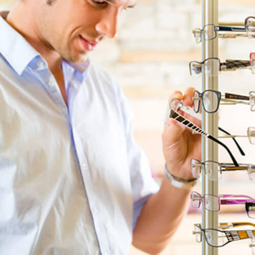 Man Looking at Glasses