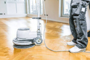 Cleaning floors with Evans Outdoors